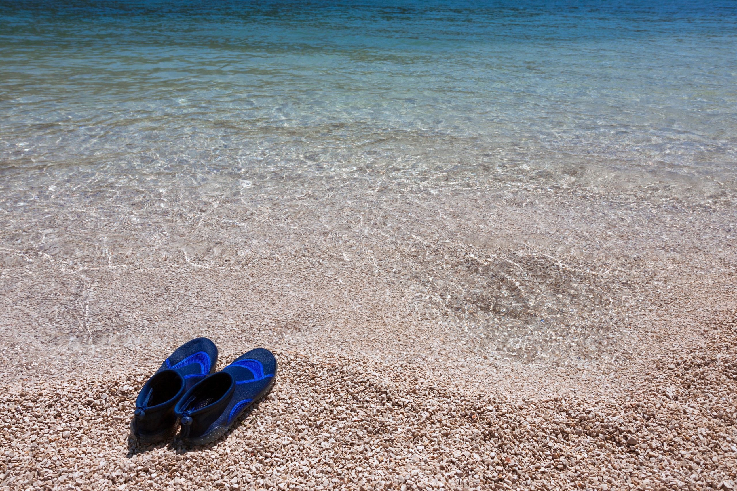 Swimming shoes are what to pack for a beach day in Hawaii